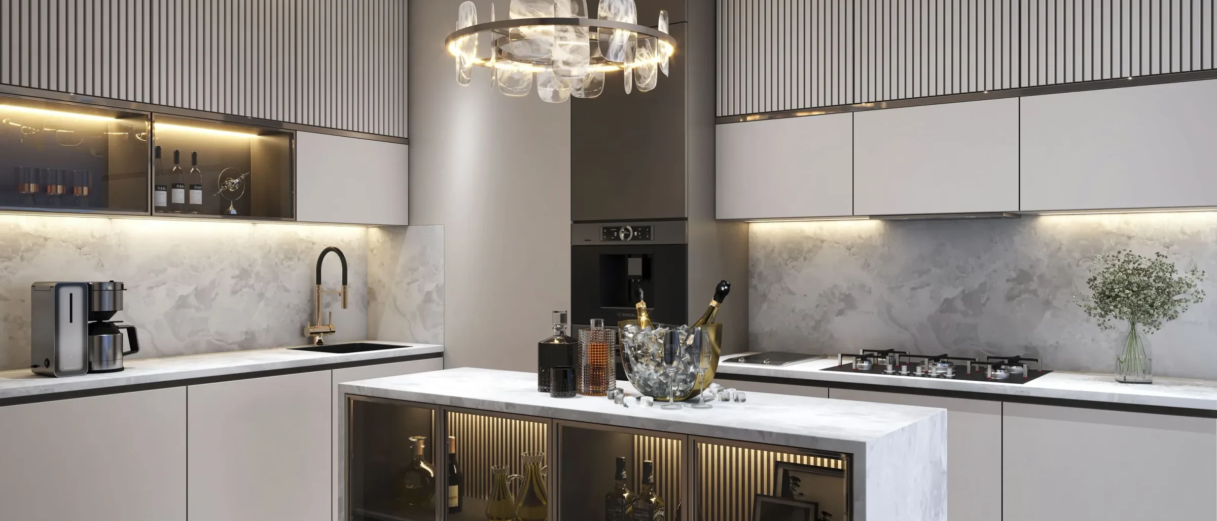 Kitchen Interiors — a modular kitchen in fluted grey and white stone under a ring chandelier